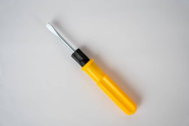 Bright yellow screwdriver isolated on a white background. Perfect for DIY, repair, and tool set concepts. 