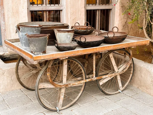 Antique wooden cart in Al Seef, Dubai. A symbol of old Emirati lifestyle surrounded by traditional architecture. 