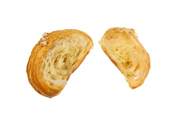 Kruvasan yarımları içerideki kırıntıları ve pürüzlü tereyağı dokusunu gösteriyor, menü ve ambalaj görselleri için ideal.. 