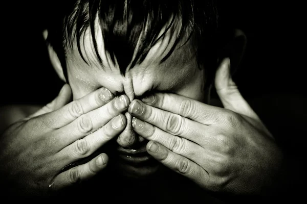 Black and white image of boy rubbing his eyes — Stock Photo, Image