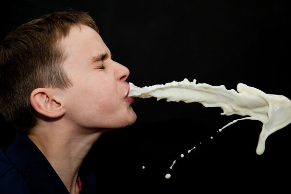 Experimental close up image of boy spitting