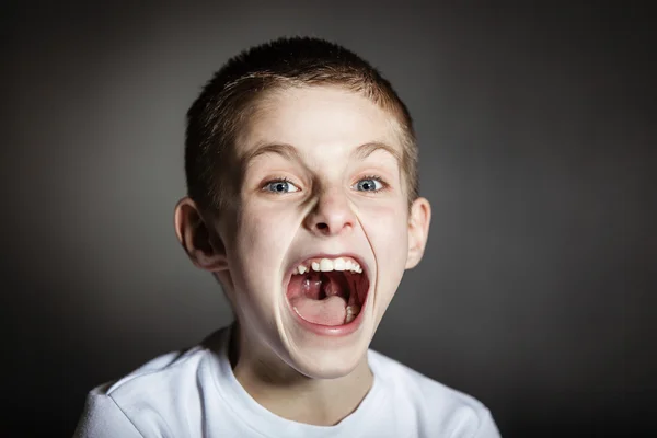 Solitary frightened boy screams in terror — Stock Photo, Image