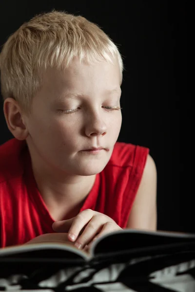 Cute blond boy reading book — Stock Photo, Image