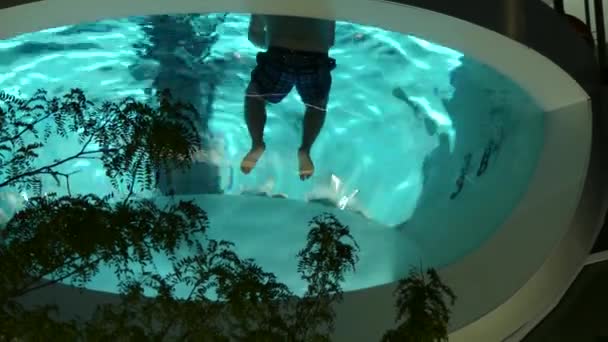Males swimming luxury pool — Stock Video