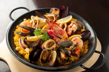 Rich and delicious paella is seafood clipart