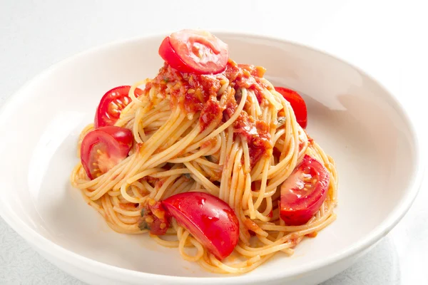 Tomatoes plenty of pasta — Stock Photo, Image