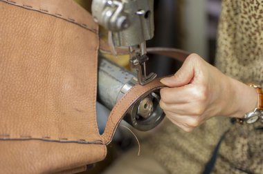 Leather repair in the sewing machine clipart