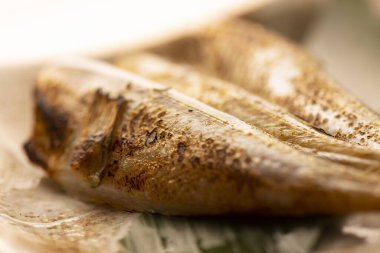 Delicious fish grilled over charcoal on a shichirin