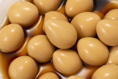 A dish made by boiling fresh quail eggs