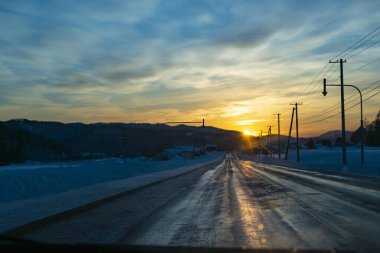 Snowy road with snow in the cold winter