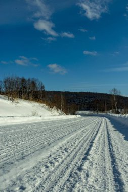 Snowy road with snow in the cold winter