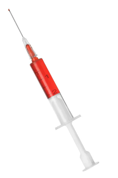 白い背景で隔離赤い薬と注射器します。 — ストック写真