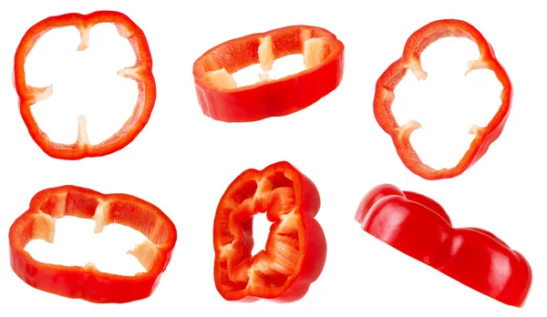 Conjunto de pimenta vermelha fatiada em um fundo branco — Fotografia de Stock