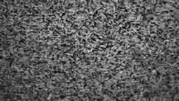 Abstraktes Rauschen des analogen Fernsehens. Digitale Panne. Beschädigung des Videosignals mit Pixelrauschen und Rauschen. Videofehler. Schwarz-weiß träumender Hintergrund. Retro-Fernseher. — Stockvideo