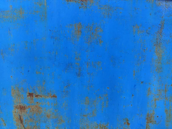 Kırık mavi boyalı paslı metal panel, paslanmış grunge metal arka plan dokusu