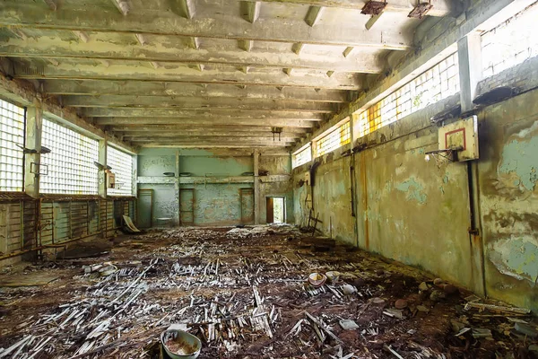 Abandoned school gym in ghost town Pripyat Chornobyl Zone, radiation, nuclear catastrofe