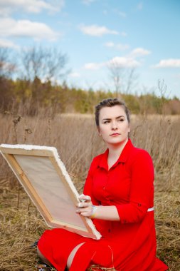 bir manzara resmi ressamın