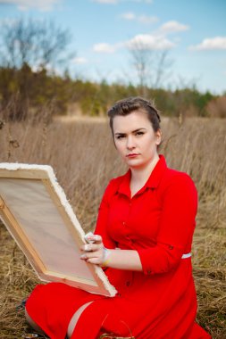 genç sanatçı bir manzara resim