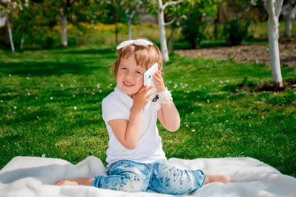 cute little girl talking on the phone