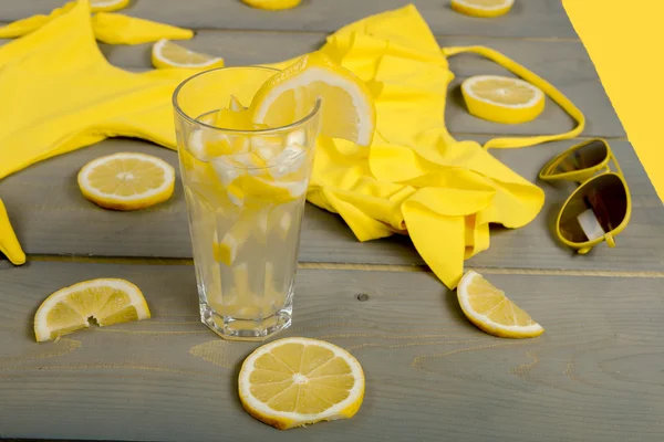 Lemonade, yellow swimsuit one-piece — Stock Photo, Image