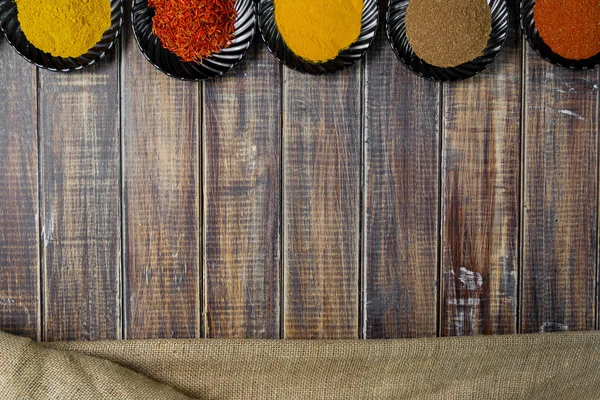 Various spices selection Saffron, turmeric, curry. different dry spices on a wooden background. — Stock Photo, Image