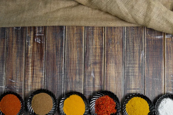 Various spices selection Saffron, turmeric, curry. different dry spices on a wooden background. — Stock Photo, Image