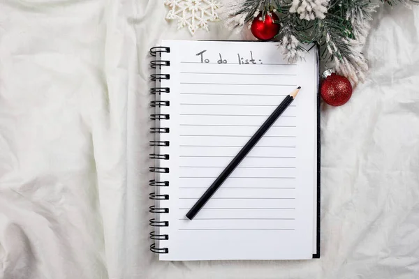Top view of blank notebook for to do list and christmas decoration