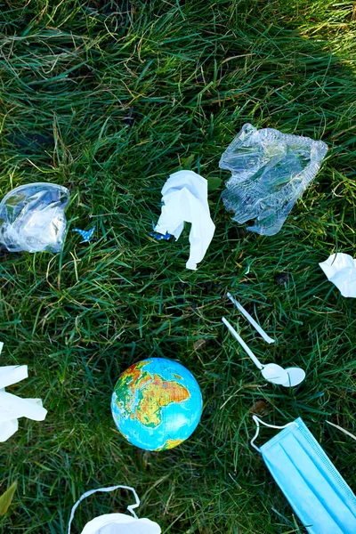 Globe Pile Scattered Garbage Background Green Grass Scattered Plastic Protective — Stock Photo, Image