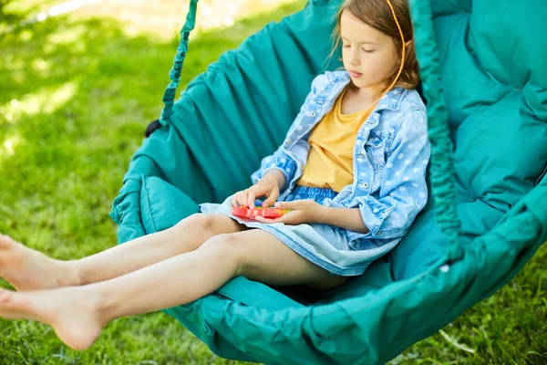 Little Girl Hanging Chair Outdoors Play Pop Kid Hands Playing — Stock Photo, Image