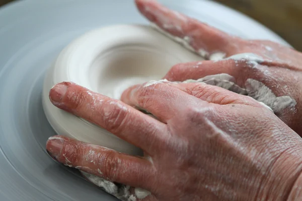 Hands of potter creating ceramic on the circle — Stock Photo, Image