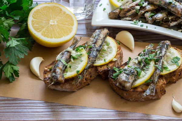 Snack from sandwiches with sardines.