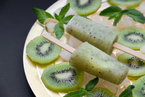 Kiwi sorbet ice cream popsicles.