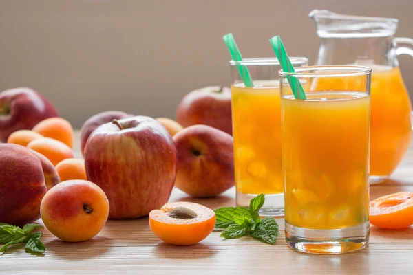 Apricot peach apple juice with ice. — Stock Photo, Image
