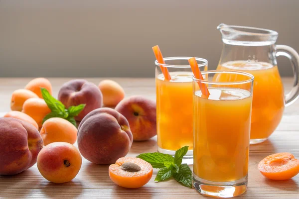Apricot and peach juice with ice. — Stock Photo, Image