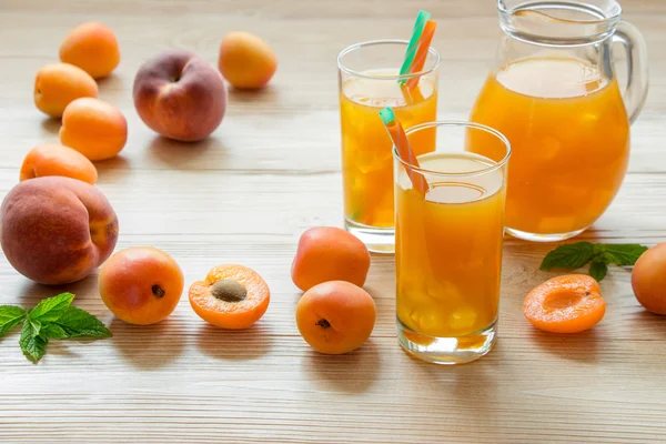 Apricot and peach juice with ice. — Stock Photo, Image