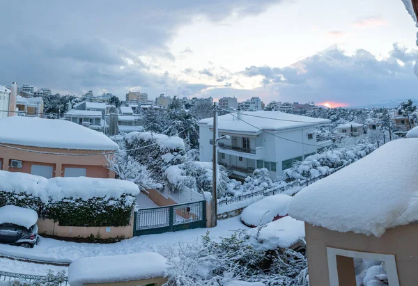 A beautiful winter evening before sunset panoramic view of the snow-covered roofs and streets of Athens city-Greece. — Stock Photo, Image