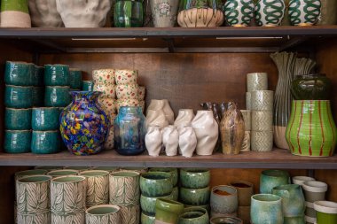 Variety of flower vases and plant pots at garden shop in springtime. Home decor. Horizontal.