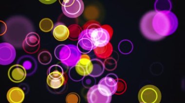 Bilgisayar çok renkli çemberler ve halkalar oluşturdu. Yuvarlak parçacıklardan soyut arkaplan oluşturma 3d