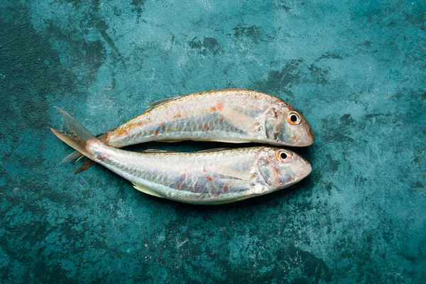 Fresh red mullet. Sultan fish on a blue background. — Stock Photo, Image