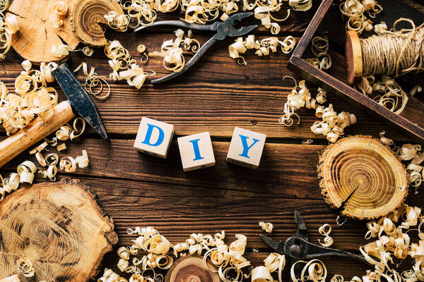 DIY wood. Woodworking workshop. Wood shavings and carpentry tools. background