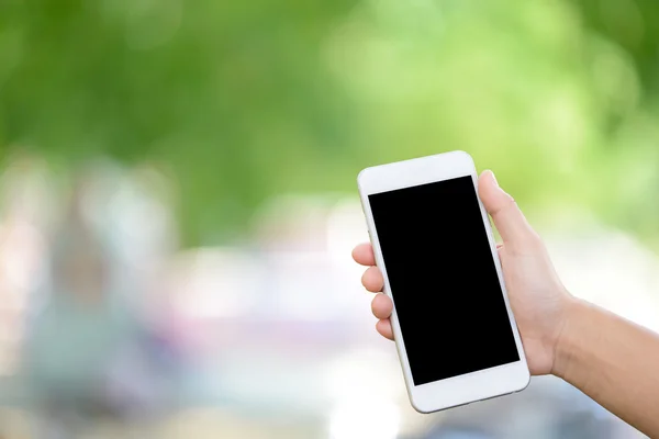 Hand holding smartphone — Stock Photo, Image