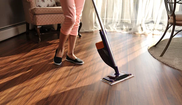 Modern mop for cleaning wooden floor from dust — Stock Photo, Image