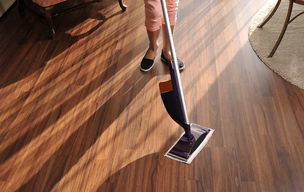 Modern mop for cleaning wooden floor from dust — Stock Photo, Image