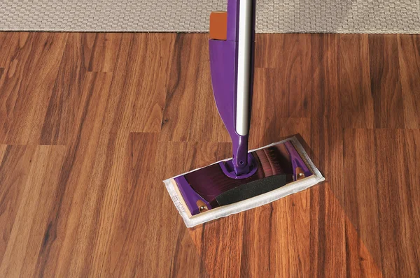 Modern mop for cleaning wooden floor from dust — Stock Photo, Image