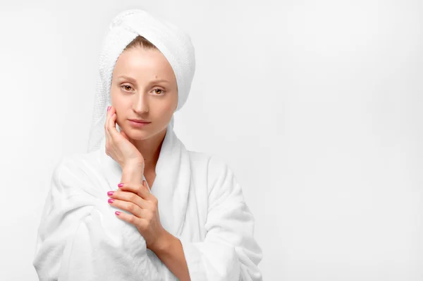 Beauty portrait of woman wearing a towel and white bathrobe — Stock Photo, Image