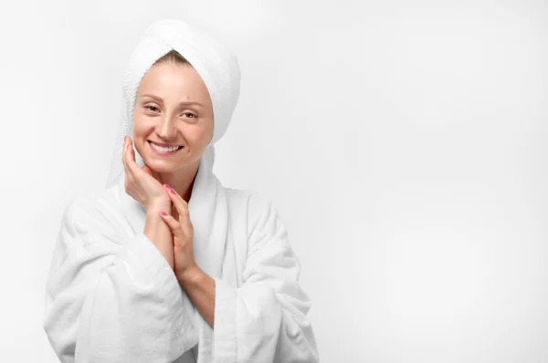 Beauty portrait of woman wearing a towel and white bathrobe — Stock Photo, Image