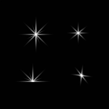 Siyah bir zemin üzerinde yıldız patlamalarına ve alevlere benzeyen dört farklı beyaz ışık efektinden oluşan bir koleksiyon. Sol üstte büyük ve belirgin bir yıldız patlaması, sağ ve sağ altta daha küçük, daha keskin patlamalarla hakim olur. Eşsiz bir yarı dairesel f