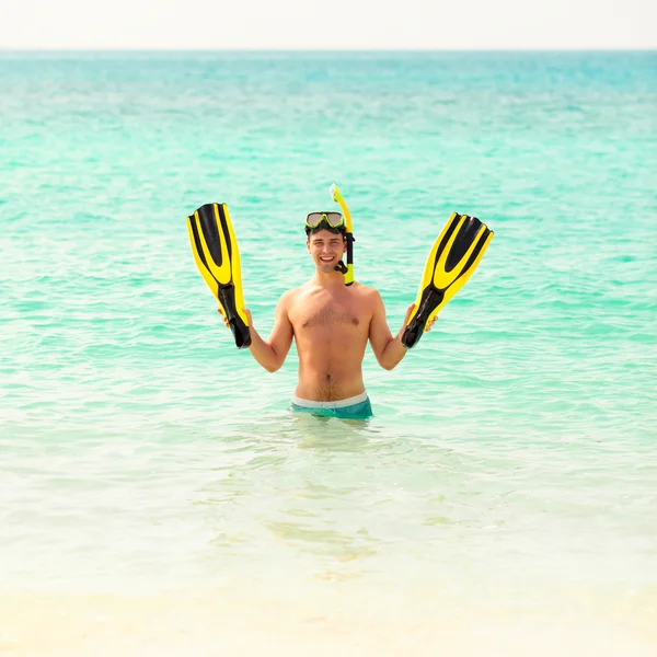 Man, relaxing in yellow black flippers fins and mask. — Stock Photo, Image