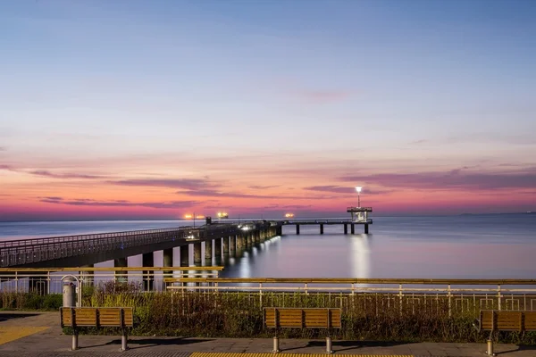 Sunrise over the sea bridge in Burgas bay — Stock Photo, Image