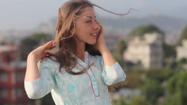 Happy Beautiful Woman Talking Phone, Using Smartphone, Smiling, Enjoying Life. it is Worth to His Chest on Roof Big City in Open Air. Kathmandu, Nepal — Stock Video